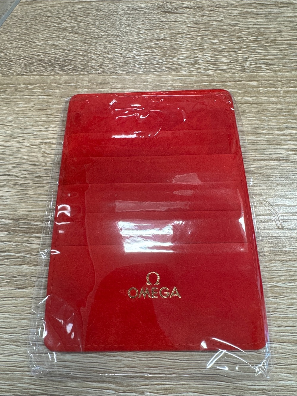 Omega Red Velvet Card Sleeve with Gold Logo